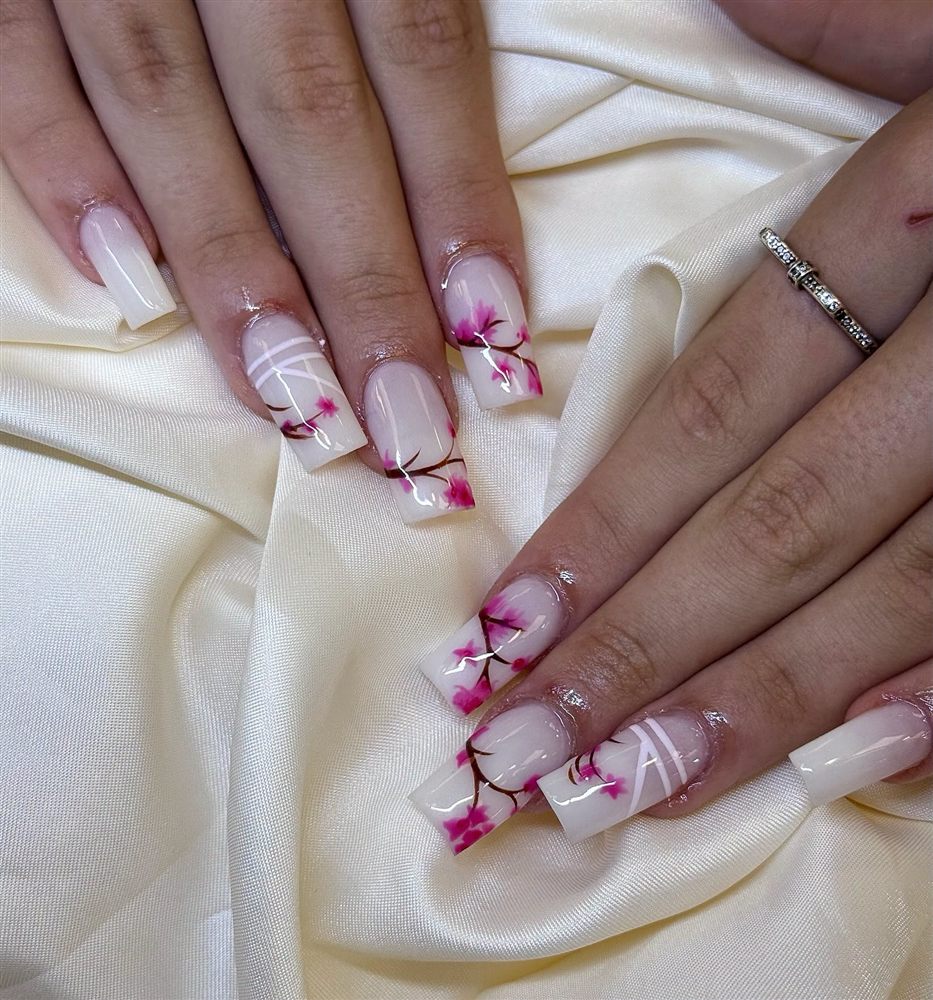 Cherry blossom nail art on long almond nails